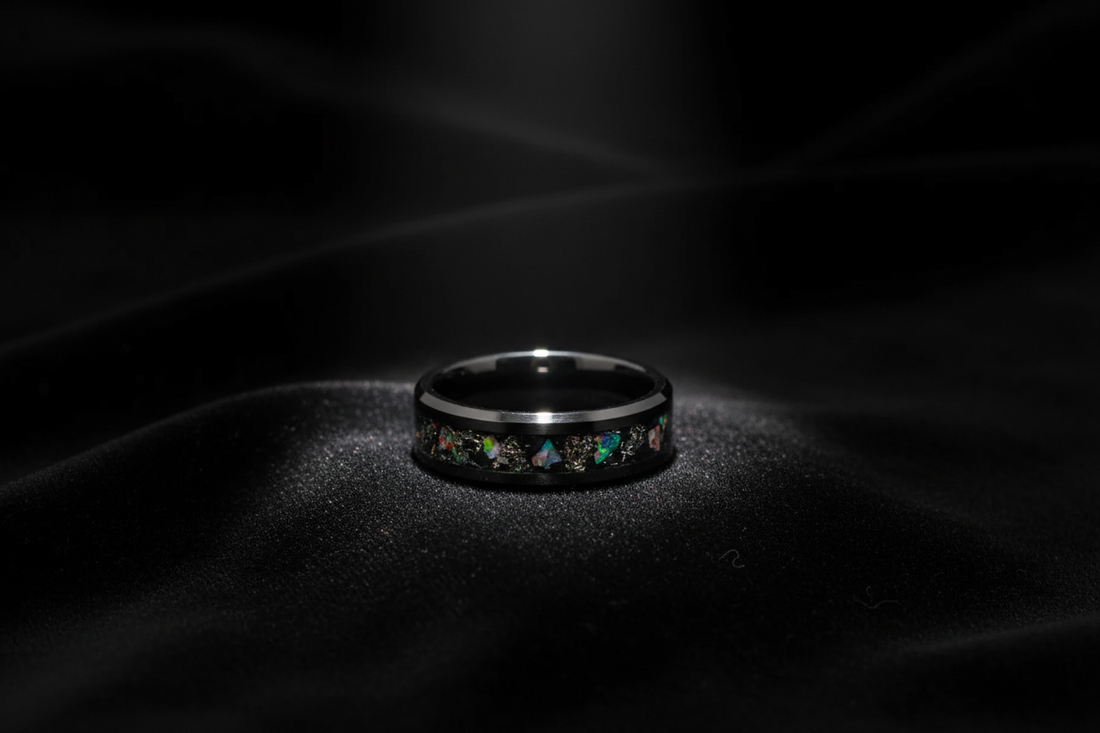 Handcrafted black ceramic opal ring on dark velvet — one of a kind wedding rings by WildBeard Legacy Co.