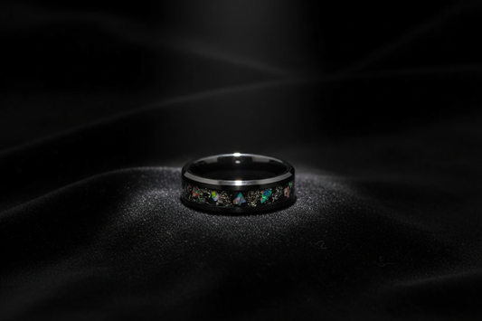 Handcrafted black ceramic opal ring on dark velvet — one of a kind wedding rings by WildBeard Legacy Co.