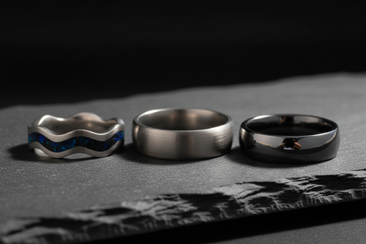 Handcrafted titanium and tungsten wedding rings side by side — titanium vs tungsten comparison, WildBeard Legacy Co., Fort Collins, CO