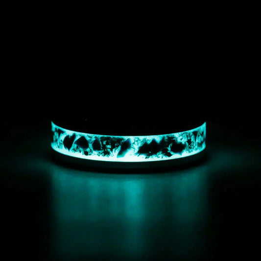 Black ring Glowing blue inlay and stones on a black background